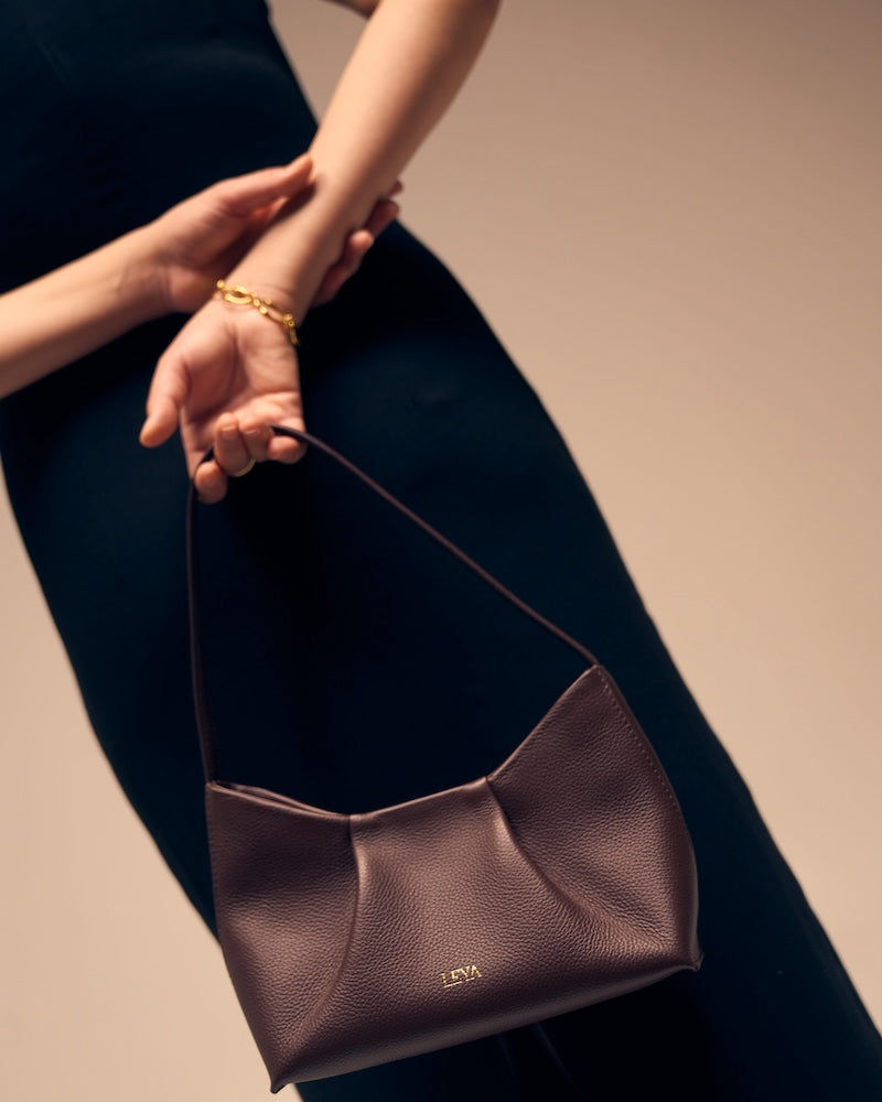 Model holding Astra Shoulder Bag Espresso