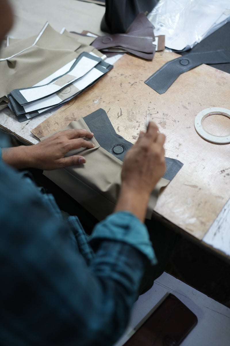 Leya artisan working on leathergoods